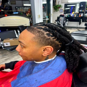 Dreadlock retwist styling by Fwresh Salon and Barbershop